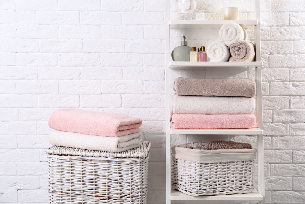 Shelving unit baskets clean towels toiletries